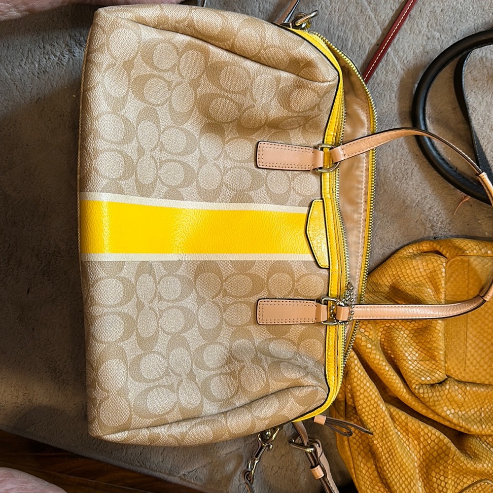 Yellow trim leather Coach signature purse